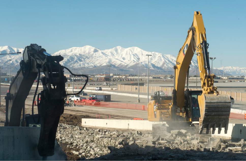 Rick Egan  |  The Salt Lake Tribune

Excavators demolish the exit ramp to what was previously the drive-through lane of the Salt Lake International Airport's short-term parking garage. The exit ramp area, as well as what formerly housed car rental canopies will become a new roadway exiting the airport the summer of 2016 to prepare for future construction projects at the airport, Monday, February 22, 2016.