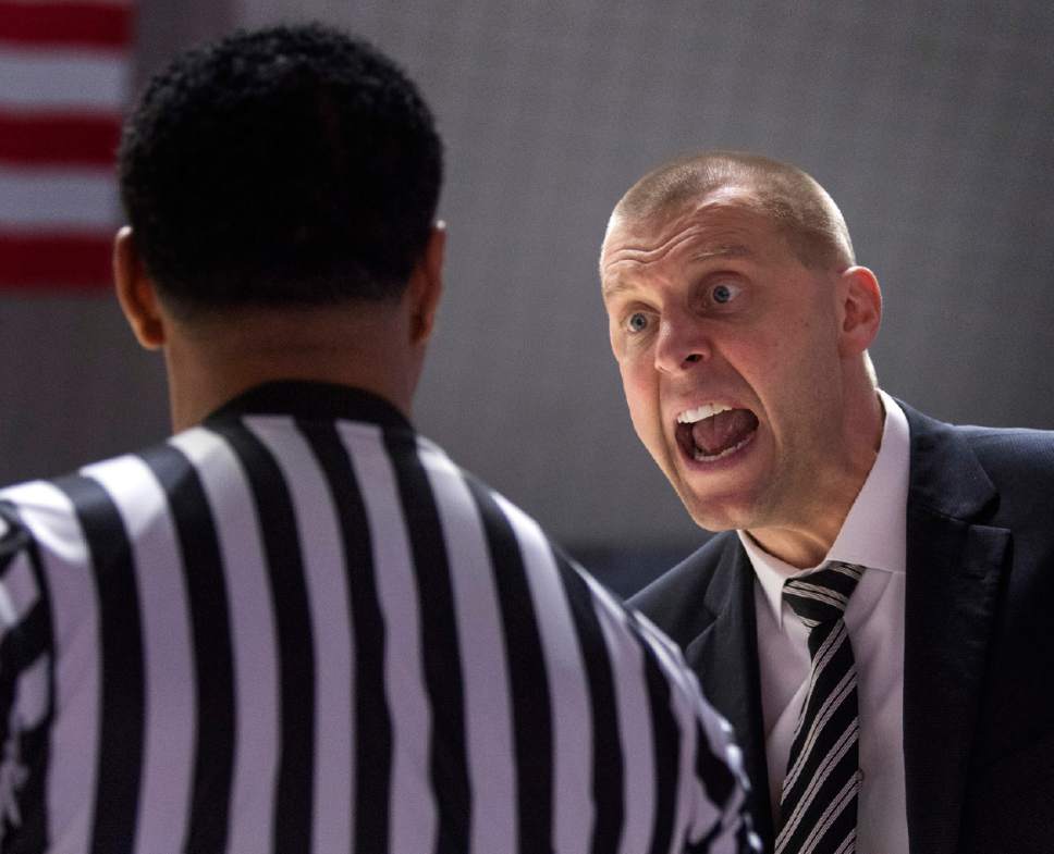 Rick Egan  |  The Salt Lake Tribune

Utah Valley Wolverines head coach Mark Pope reacts to a call by the official, in basketball action, Weber State Wildcats vs Utah Valley Wolverines, n Ogden, Saturday, December 17, 2016.