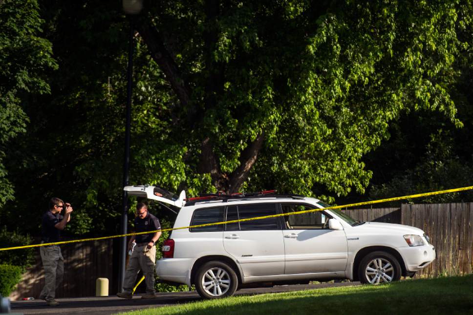 Chris Detrick  |  The Salt Lake Tribune
Police officers investigate the scene of a shooting Tuesday, June 6, 2017. The shooting occurred at about 3:45 p.m. outside of a residence at about 2175 East and Alta Canyon Drive (about 8630 South), said Sandy police Sgt. Jason Nielsen. Nielsen said the shooter was among the dead and, therefore, there is no threat to the public.