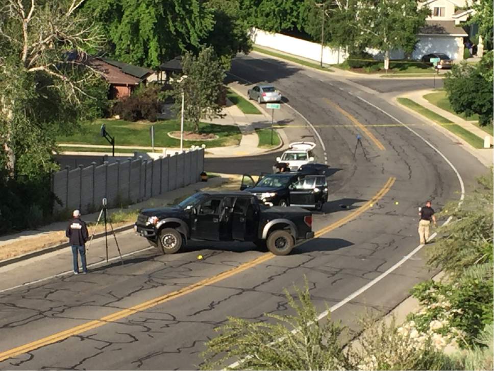 Luke Ramseth  |  The Salt Lake Tribune

A man in this black pickup rammed an SUV, shown behind the truck, before he exited and opened fire on the SUV on Sandyís Alta Canyon Drive on Tuesday, June 6, 2017.