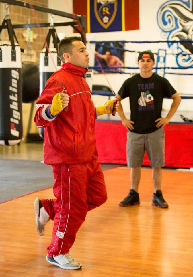 Rick Egan  |  The Salt Lake Tribune

West Valley City's Jose Haro works out, as his brother Eric, who is also his trainer looks on, at the Reyes Boxing Gym in West Vally City. Monday, June 5, 2017.