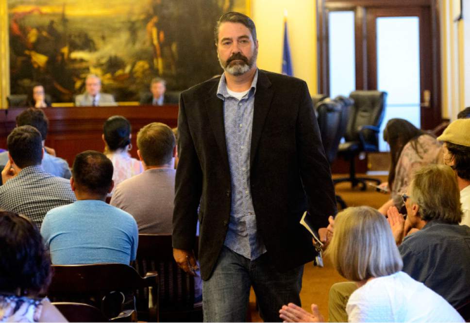 Steve Griffin  |  The Salt Lake Tribune
Democratic Party Chairman candidate Rob Miller walks out of a town hall meeting for all chairmen candidates after audience members continued to protest him as he answered questions during the meeting at the State Capitol in Salt Lake City on Wednesday. Miller said he was excusing himself from the meeting to avoid any more disruption to meeting. Members of the audience stood with their backs to the candidates as Miller tried to answer questions. The town hall comes after party officials had a meeting about what to do with allegations about sexual harassment against Miller.