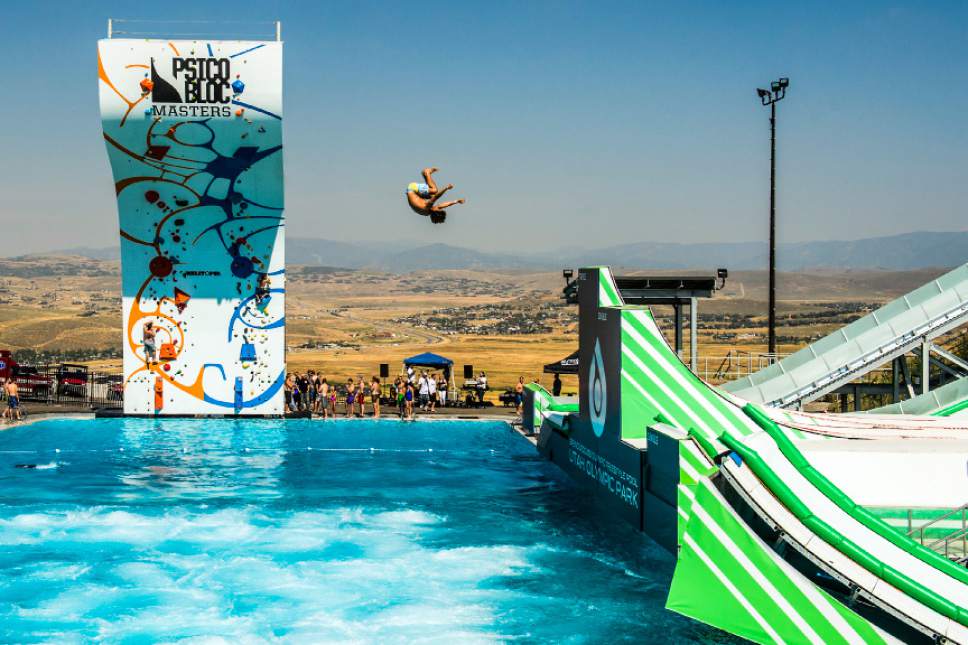 Chris Detrick  |  The Salt Lake Tribune
A man launches off a ramp into the one million gallon pool during Slip n' Soar at Utah Olympic Park Saturday August 20, 2016.