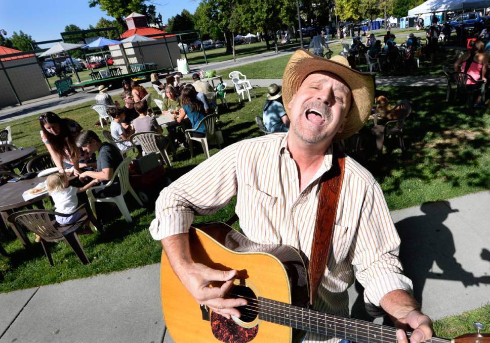 Scott Sommerdorf | The Salt Lake Tribune
Musician Jim "Fish" Svendsen sings "American Country / Folk songs at the opening day of the Salt Lake City Farmer's Market, Saturday, June 10, 2017.