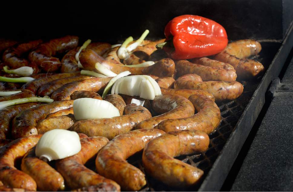 Scott Sommerdorf | The Salt Lake Tribune
Italian sausages on the grill at Marcello's Italian Restaurant booth at the opening day of the Salt Lake City Farmer's Market, Saturday, June 10, 2017.
