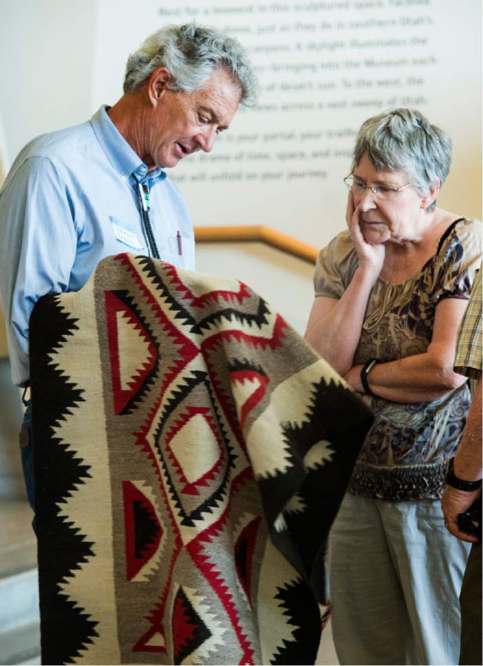 Rick Egan  |  The Salt Lake Tribune


Jackson Clark II, the owner of Toh-Atin Gallery, Durango, Colo., talks to Susan Thomas about a Navajo rug that has been in her family for 40 years on Friday, June 9, 2017.