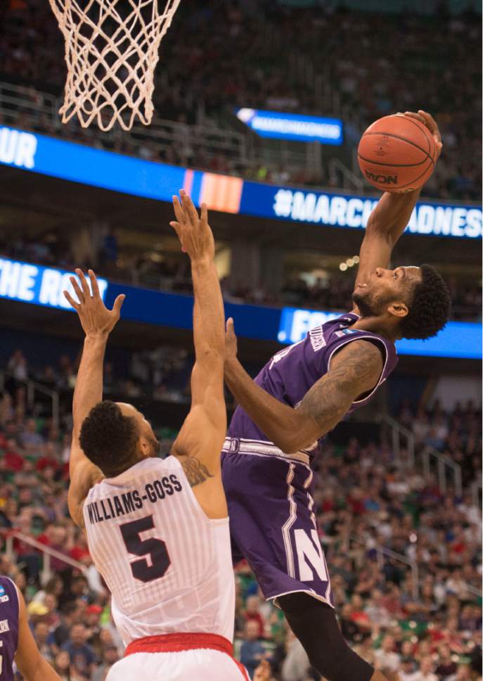 Trent Nelson  |  The Salt Lake Tribune

Northwestern Wildcats forward Vic Law (4) gets a rebound over Gonzaga Bulldogs guard Nigel Williams-Goss (5) as the teams face off in the NCAA tournament in Salt Lake City on Saturday, March 18, 2017.