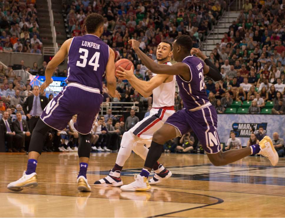 Trent Nelson  |  The Salt Lake Tribune

Gonzaga Bulldogs guard Nigel Williams-Goss (5) looks to pass the ball under pressure from Northwestern Wildcats guard Sanjay Lumpkin (34) and Northwestern Wildcats guard Scottie Lindsey (20) as the teams face off in the NCAA tournament in Salt Lake City on Saturday, March 18, 2017.