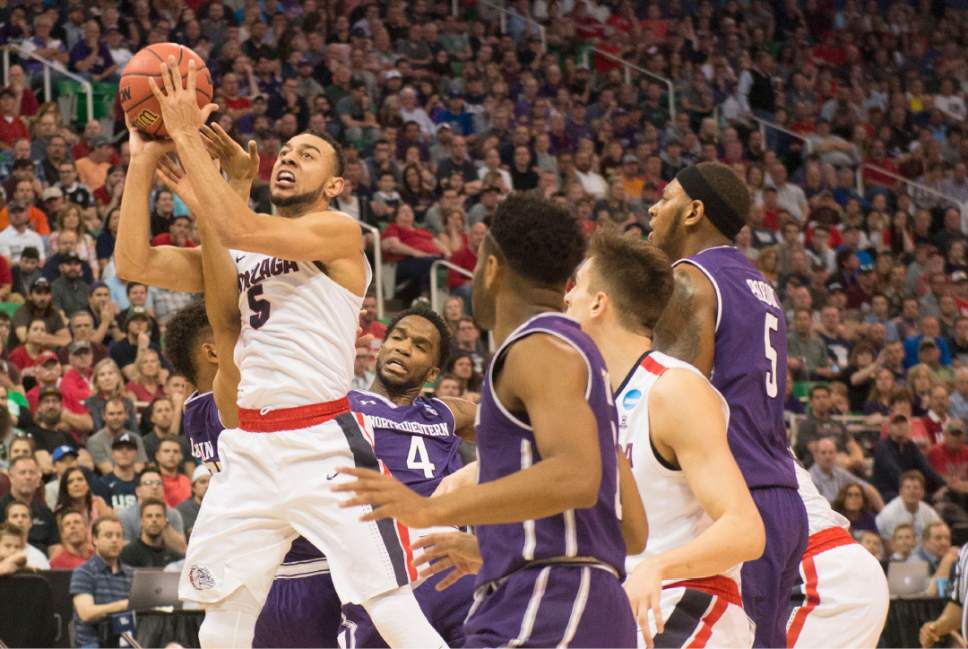 Chris Detrick  |  The Salt Lake Tribune

Gonzaga Bulldogs guard Nigel Williams-Goss (5) drives to the hoop through a number of Northwestern players as the teams face off in the NCAA tournament in Salt Lake City on Saturday, March 18, 2017.