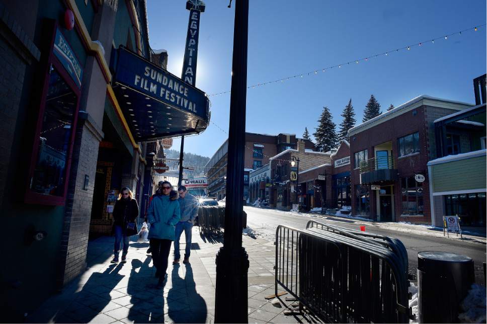 Scott Sommerdorf   |  The Salt Lake Tribune  
Visitors pass The Egyptian Theatre on Main Street in Park City prior to the beginning of the Sundance Film Festival on Wednesday, Jan. 18, 2017.