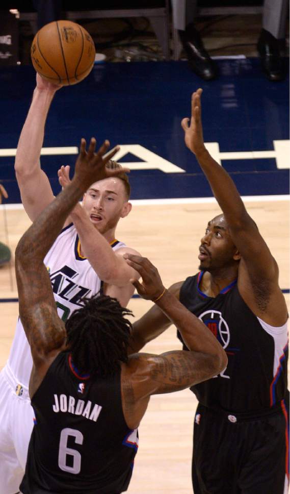 Leah Hogsten  |  The Salt Lake Tribune 
Utah Jazz forward Gordon Hayward (20) looks for the pass under the heavy defense of LA Clippers center DeAndre Jordan (6)and LA Clippers forward Luc Mbah a Moute (12). The Utah Jazz trail the Los Angeles Clippers 59-62 in the third quarter during Game 6 at Vivint Smart Home Arena, Friday, April 28, 2017 during the NBA's first-round playoff series.