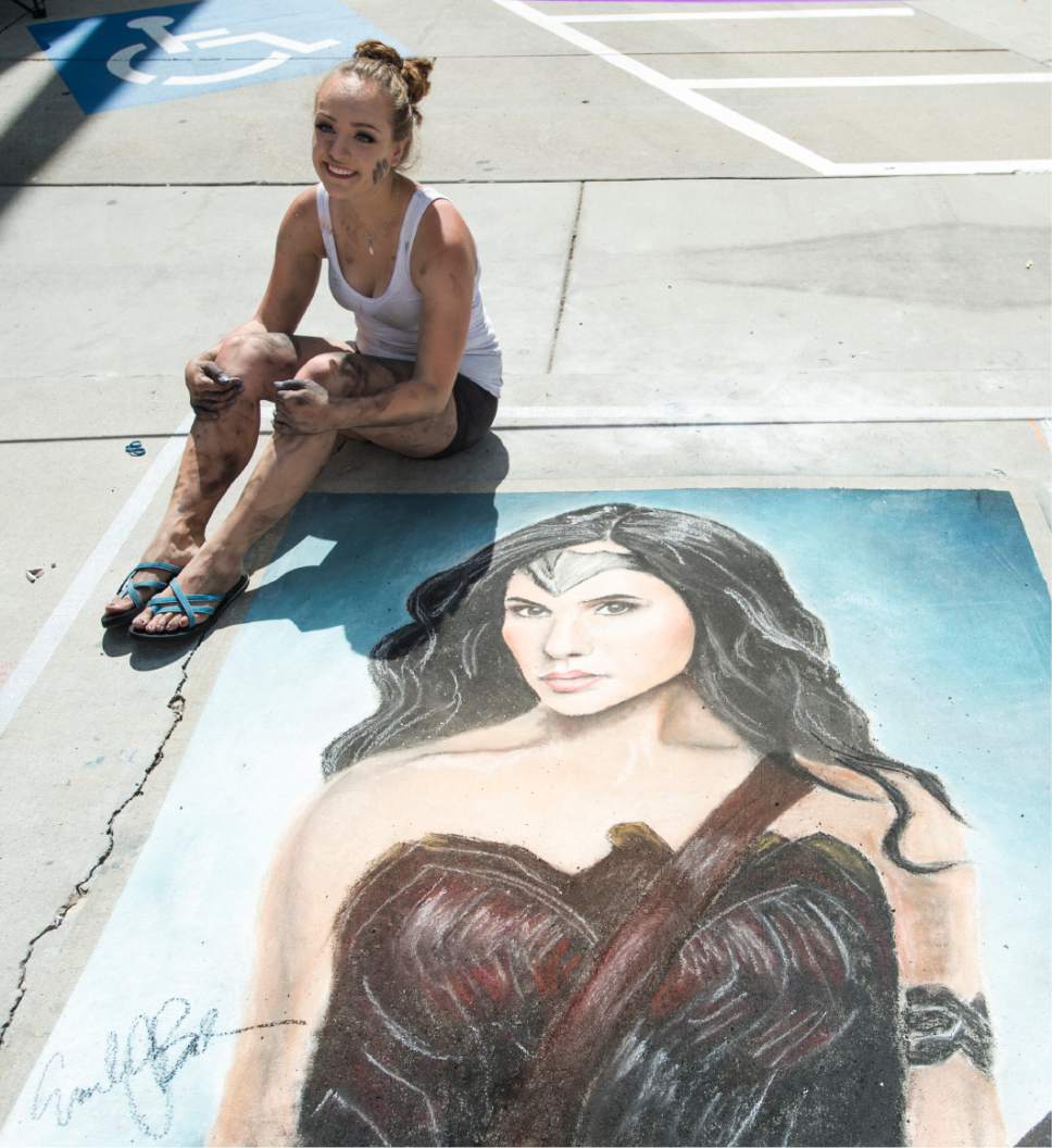Rick Egan  |  The Salt Lake Tribune

Emily Beck pauses for a photo after finishing her drawing, on Rio Grande Street at the Gateway, during the Utah Foster Care Chalk Art Festival, Saturday, June 17, 2017.