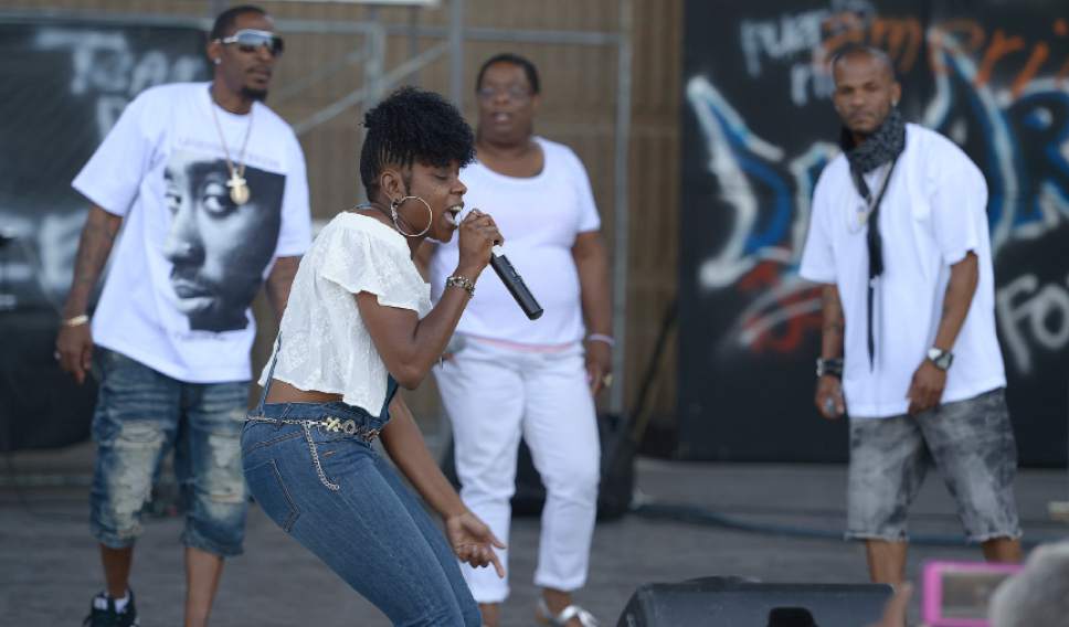 Leah Hogsten  |  The Salt Lake Tribune
l-r Konvrtd Voices singers Michael Young, Kimberly Robinson, D'Adrieanna Roberts and Anthony Robinson perform at the 28th Annual Juneteenth Freedom and Heritage Festival, Saturday, June 18, 2017 at the Utah Cultural Celebration Center. Juneteenth celebrates the end of slavery in the United States.