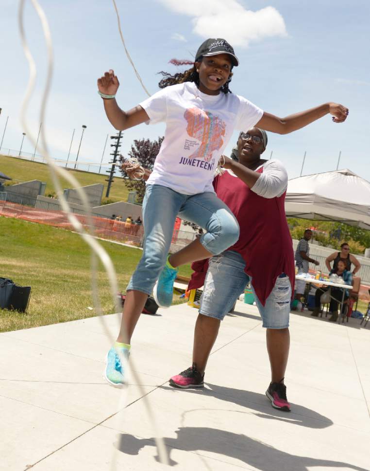 Leah Hogsten  |  The Salt Lake Tribune
Angel Marshal, 15, tries "double dutch" jumprope for the first time at the 28th Annual Juneteenth Freedom and Heritage Festival on Saturday, at the Utah Cultural Celebration Center. Juneteenth celebrates the end of slavery in the United States.