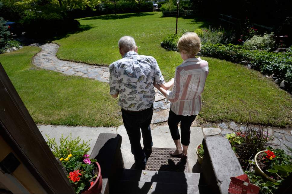 Scott Sommerdorf | The Salt Lake Tribune
Joan Crowther helps her husband Carl as they walk to the front yard of their historic West Jordan home. They  are petitioning the city to purchase the historic property and turn it into an art gallery, Wednesday, June 7, 2017.