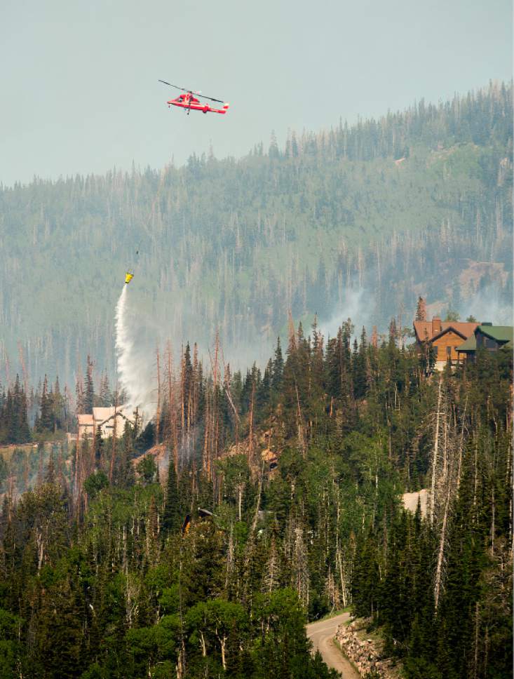 Leah Hogsten  |  The Salt Lake Tribune
Firefighting crews and air tankers work to put out a wildfire along the Steam Engine area on Sunday, June 18, 2017 within Brian Head. The fire forced hundreds to evacuate from the southern Utah ski town.