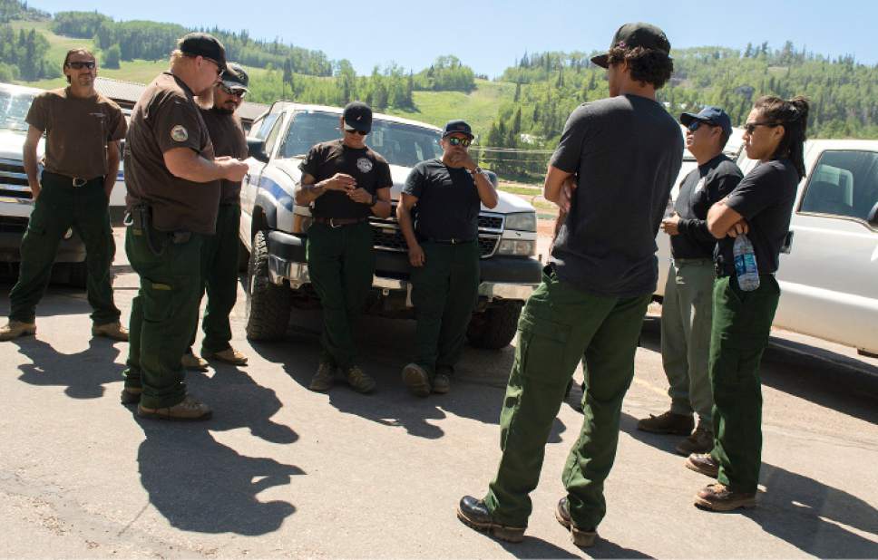 Leah Hogsten  |  The Salt Lake Tribune
Firefighters with the Truxton Canyon Agency out of Peach Springs, AZ and the Southern Piute Agency out of St. George, UT gather to hear their assignment before heading out on the fire line, Sunday, June 18, 2017 on a wildfire that forced hundreds to evacuate from the southern Utah ski town of Brian Head.