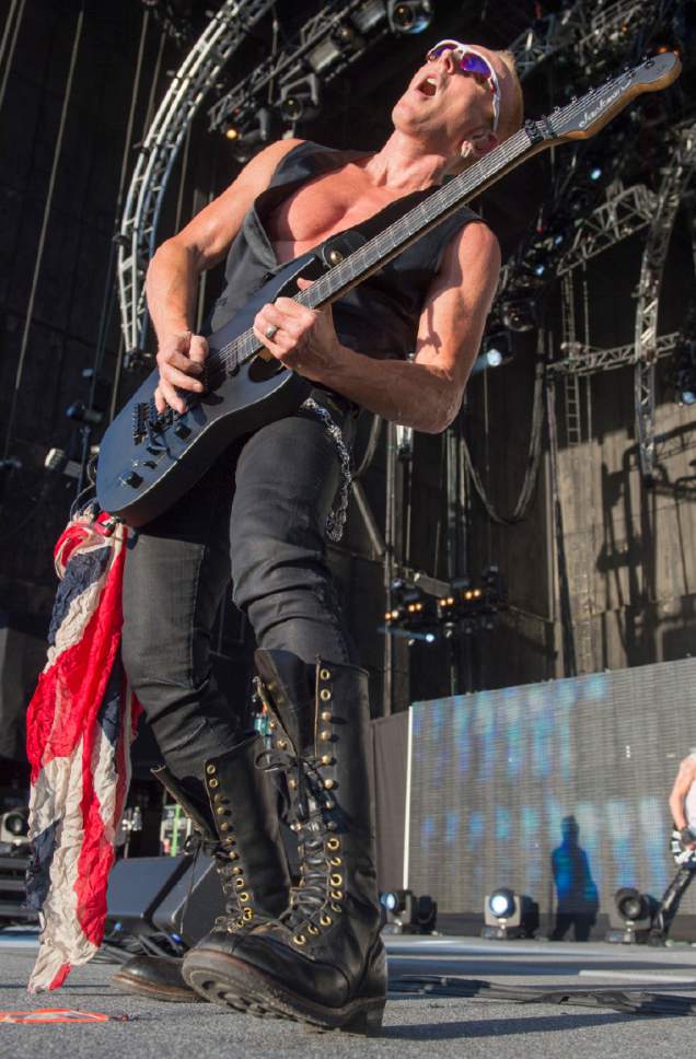 Rick Egan  |  The Salt Lake Tribune

Phil Collen plays guitar for Def Leppard as they play USANA Amphitheatre, Monday, June 23, 2014