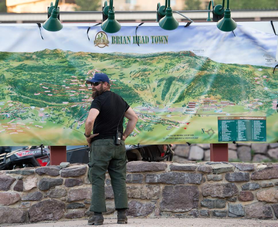 Leah Hogsten  |  The Salt Lake Tribune
A wildland firefighter from Montana checks out the Brian Head town map near the town hall Sunday, June 18, 2017, with working a wildfire burning north of the southern Utah ski town of Brian Head.