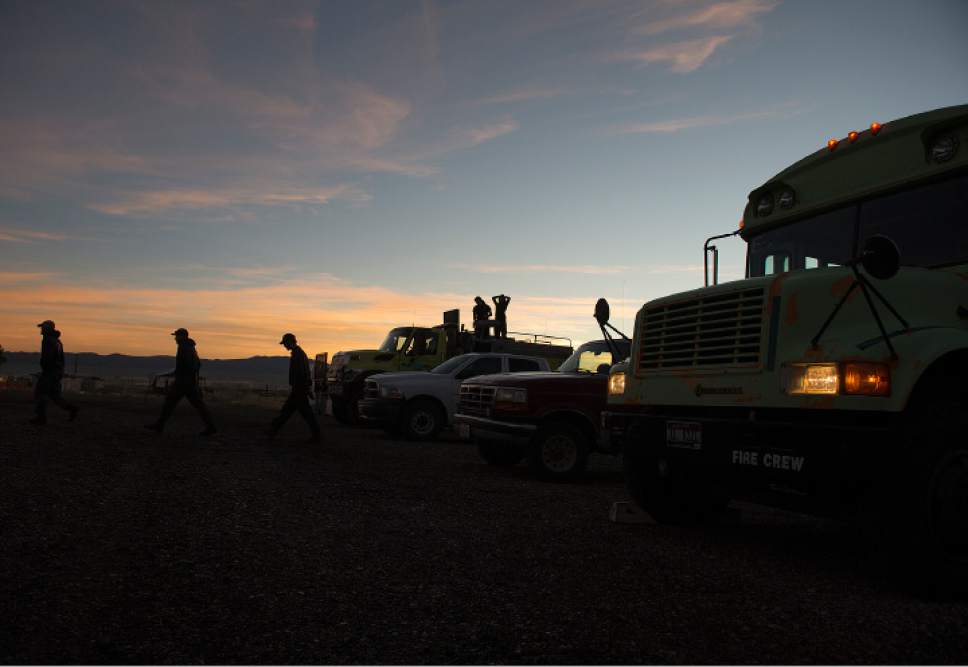 Leah Hogsten  |  The Salt Lake Tribune
Firefighting crews get ready to roll out for the day on the fire line from the Iron County Fairgrounds in Parawan, Monday, June 19, 2017, to put out a wildfire burning north of the southern Utah ski town of Brian Head.