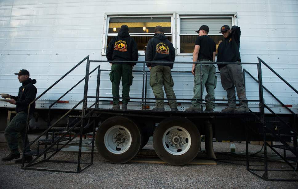 Leah Hogsten  |  The Salt Lake Tribune
Firefighting crews are served breakfast before they head out for the day on the fire line from the Iron County Fairgrounds in Parawan, Monday, June 19, 2017, to put out a wildfire burning north of the southern Utah ski town of Brian Head.