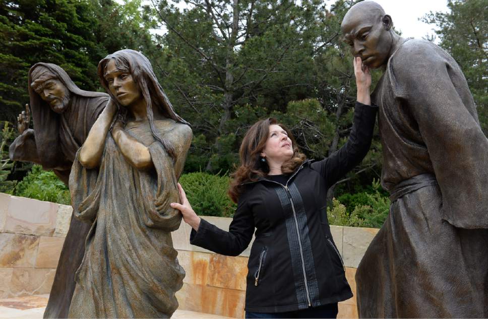 Francisco Kjolseth  |  The Salt Lake Tribune
Artist Angela Johnson talks about her work at the "Light of the World" exhibit, in the heart of Thanksgiving Point's Ashton Gardens in Lehi. Conveying passion, humanity and miracles from the life of Jesus Christ, 15 scenes with 35 sculptures adorn the new centralized permanent exhibit at the gardens.