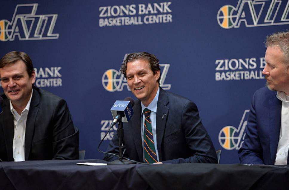 Scott Sommerdorf   |  The Salt Lake Tribune
The Utah Jazz introduce their new head coach, Quinn Snyder, center, Saturday, June 7, 2014. Jazz GM Dennis Lindsey is at left, and Jazz CEO Greg Miller is at right.