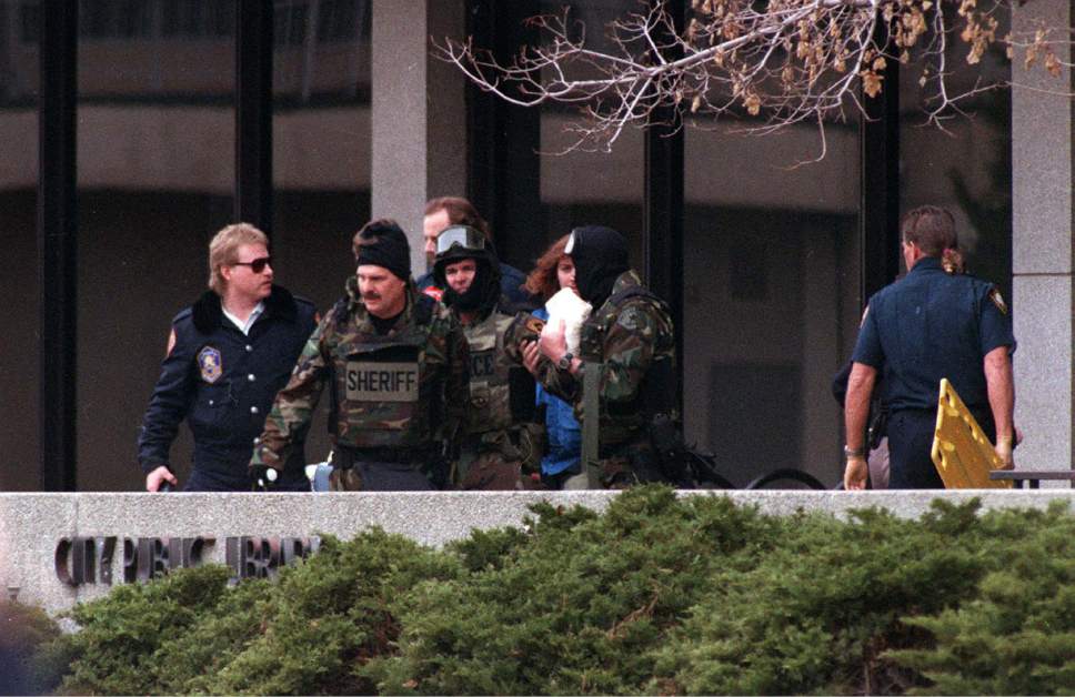 Steve Griffin  |  Tribune file photo


Salt Lake County Sheriff's deputies exit the Salt Lake City Public Library, March 5, 1994 after a hostage situation within the building.
