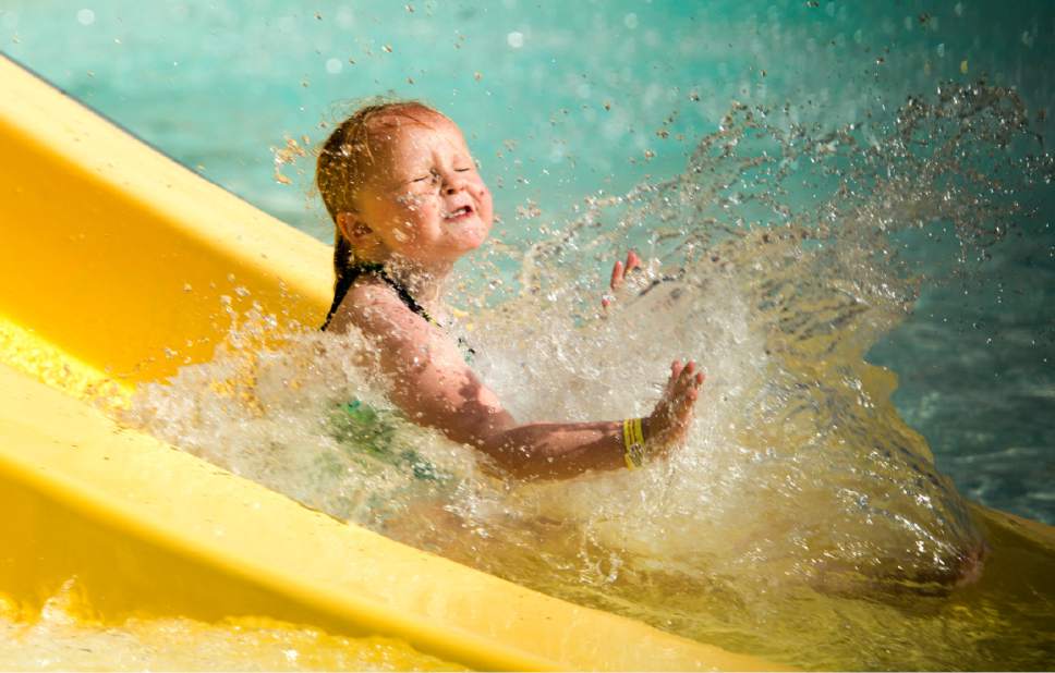 Rick Egan  |  The Salt Lake Tribune

Sierra Norton, 5, cools off by sliding into the water at the Kearns Oquirrh Park Fitness Center, Monday, June 5, 2017.