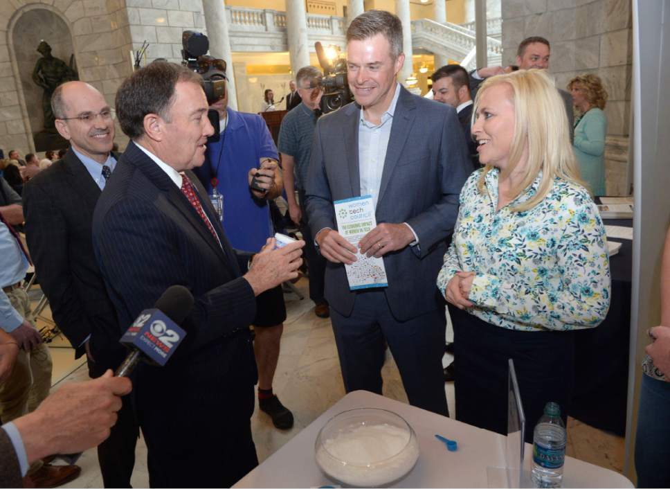 Tribune file photo | Al Hartmann  
Gov. Gary Herbert, left, visited with Vance Checketts from Dell-EMC and Cydni Tetro, chairwoman of the Utah Women's Tech Council, in March when he launched the application process for $2.1 million in "Talent Ready Utah" grants. A dozen partnerships will split the money, designed to help students get into the careers of the future.