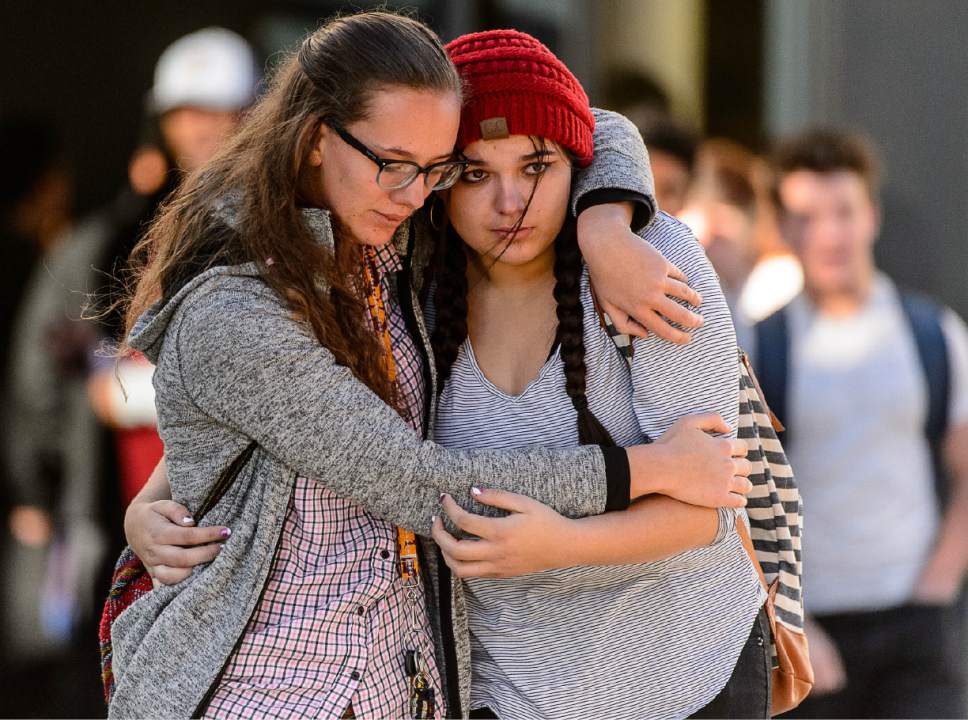 Trent Nelson  |  The Salt Lake Tribune
Students Holly Hilton and Albany Cox embrace after a 16-year-old boy allegedly stabbed several other male students before reportedly turning his knife on himself at Mountain View High School in Orem Tuesday November 15, 2016.