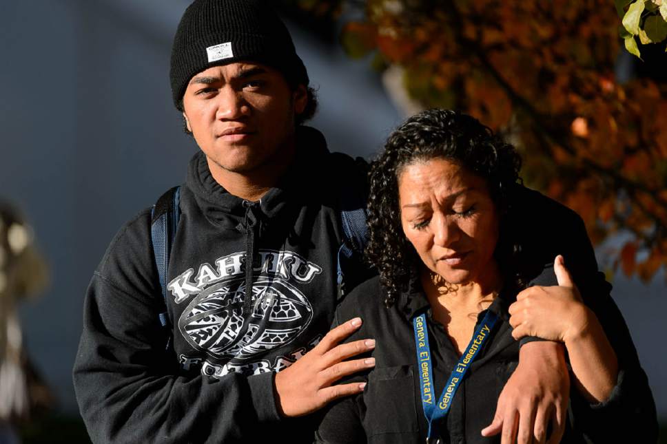 Trent Nelson  |  The Salt Lake Tribune
Seta Unga, right, with her son Aisea. Parents pick up their students after a 16-year-old boy allegedly stabbed several other male students before reportedly turning his knife on himself at Mountain View High School in Orem Tuesday November 15, 2016.