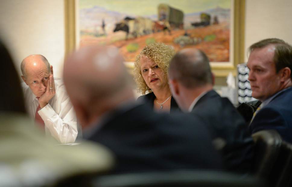 Francisco Kjolseth |  Tribune file photo
Lt. Gov. Spencer Cox, center right, takes note of concerns presented by Salt Lake City Mayor Jackie Biskupski, center, during a May 18, 2017, board meeting of the private nonprofit Shelter the Homeless.