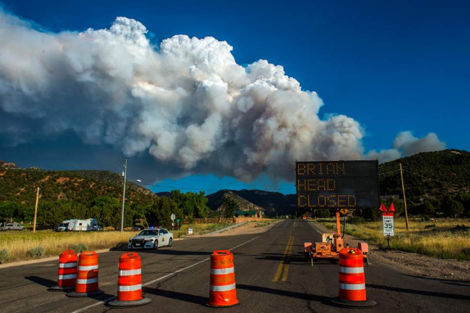 Chris Detrick  |  The Salt Lake Tribune
Smoke rises from the wildfire burning north of the southern Utah ski town of Brian Head as seen from Parowan Tuesday, June 20, 2017. The Brian Head Fire -- which forced the evacuation of about 750 residents and visitors on Saturday -- was started by someone using a weed torch in dry conditions, Gov. Gary Herbert tweeted Tuesday, ahead of a 1 p.m. news conference.