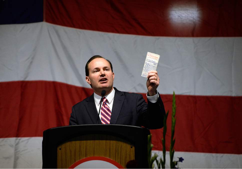 Scott Sommerdorf | The Salt Lake Tribune
U.S. Senator Mike Lee (R-UT), waves his copy of the Constitution during his opening speech at the Utah Republican Party Organizing Convention, Saturday, May 19, 2017.