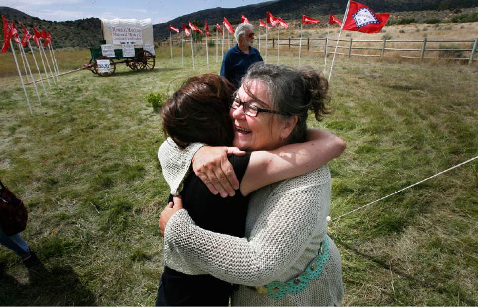Scott Sommerdorf  |  Tribune file photo             
Karen Fancher, right, hugs Shannon Novak after a ceremony at the Mountain Meadows Massacre site Sunday, Sept. 11, 2011.  Novak is a forensic expert who examined the remains of massacre victims.