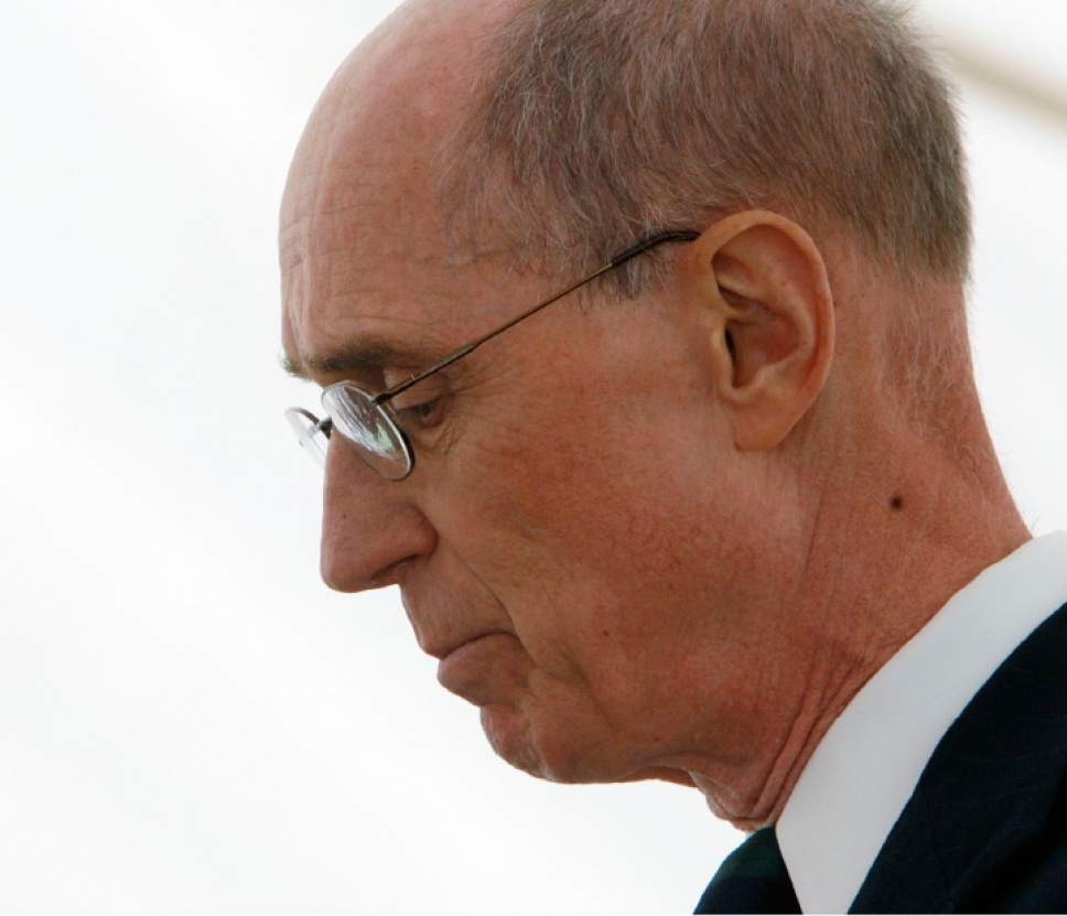 Steve Griffin  |  Tribune file photo
Henry B. Eyring, now a member of the governing First Presidency of The Church of Jesus Christ of Latter-day Saints, lowers his head while speaking during the Mountain Meadows Massacre Memorial on Sept. 11, 2007.