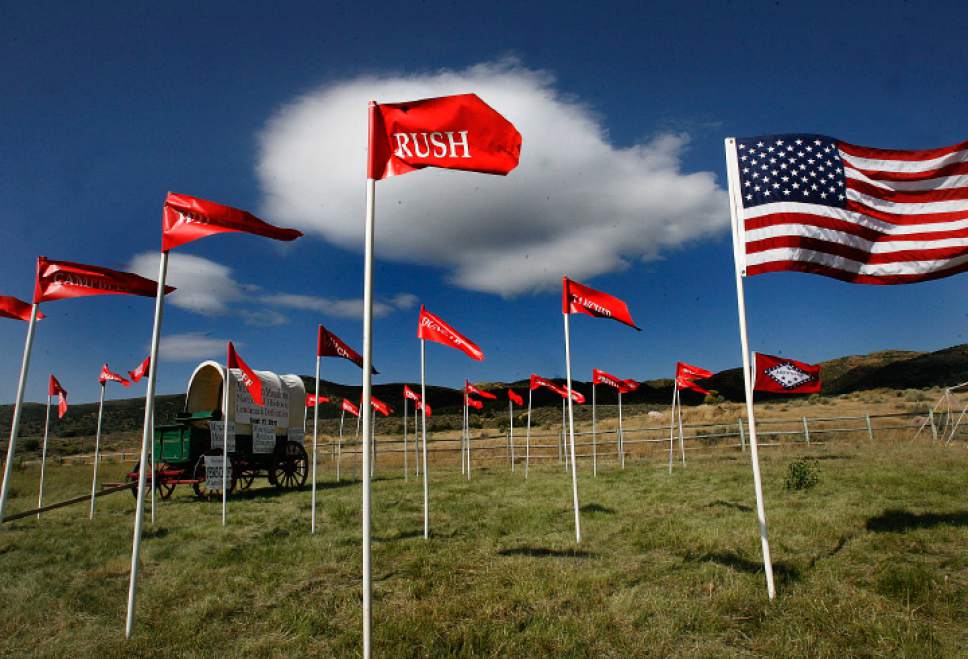 Scott Sommerdorf  |  The Salt Lake Tribune             
Flags bearing names of those families who had family members killed in the Mountain Meadows Massacre fly at the site on Sunday, Sept. 11, 2011.