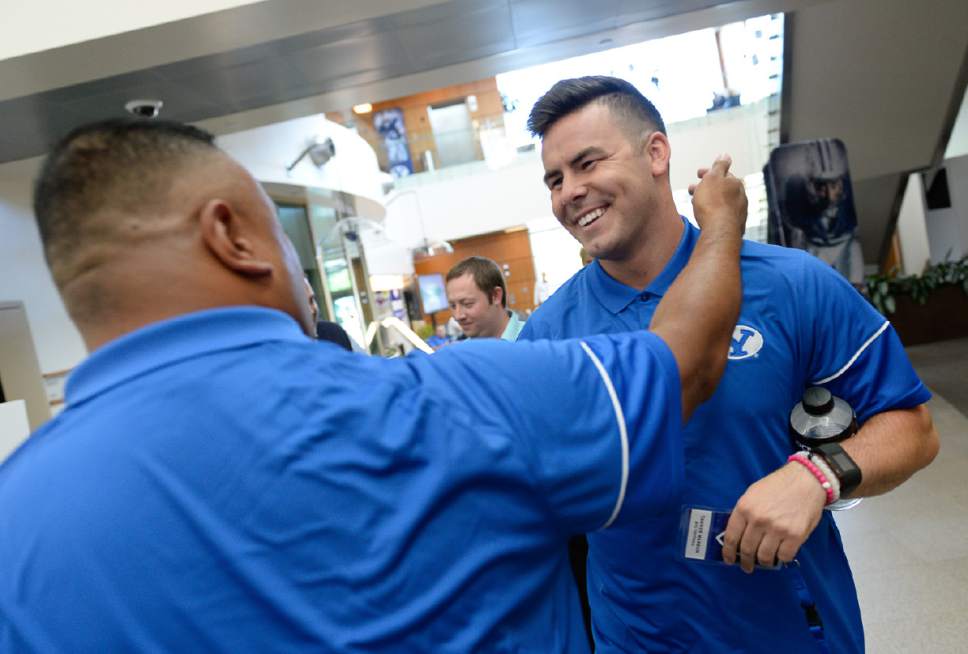 Francisco Kjolseth  |  The Salt Lake Tribune


BYU quarterback Tanner Mangum, right, gets a warm welcome from head coach Kalani Sitake during BYU Football Media Day at BYU Broadcasting in Provo on Friday, June 23, 2017.