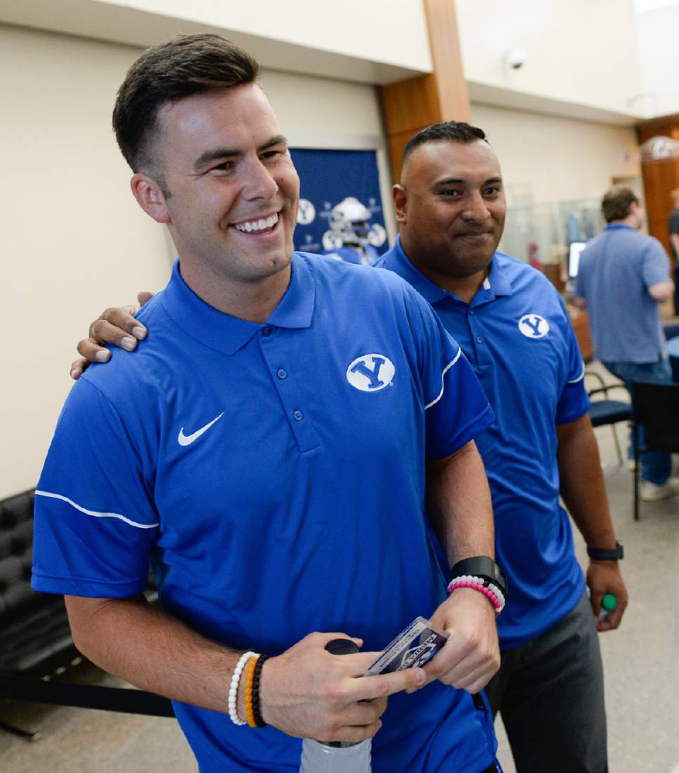 Francisco Kjolseth  |  The Salt Lake Tribune


BYU quarterback Tanner Mangum gets a warm welcome from head coach Kalani Sitake during BYU Football Media Day at BYU Broadcasting in Provo on Friday, June 23, 2017.