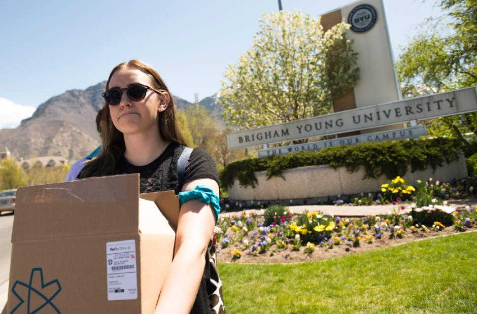 Leah Hogsten  |  The Salt Lake Tribune
Lauren Stratton carried the box of  60,000 signatures but said the group has over 90,000 signatures. Care2 petition supporters delivered 60,000  petition signatures to Brigham Young University's Abraham O. Smoot administration building, Wednesday, April 20, 2016 to protest the school's "Honor Code" and to ask the school to add an immunity clause shielding sexual assault victims from Honor Code investigations.