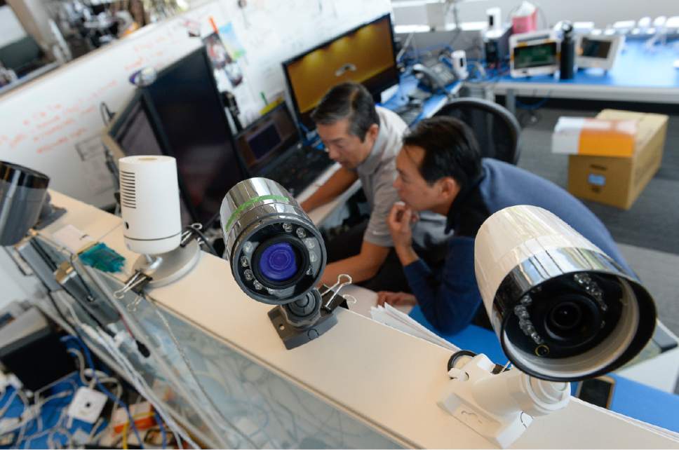Francisco Kjolseth | The Salt Lake Tribune
Craig Matsuura, left, director of invetted software and software engineer Johny Bui, continue their ongoing work on making surveillance cameras smaller and better at the Vivint Innovations Center in Lehi.