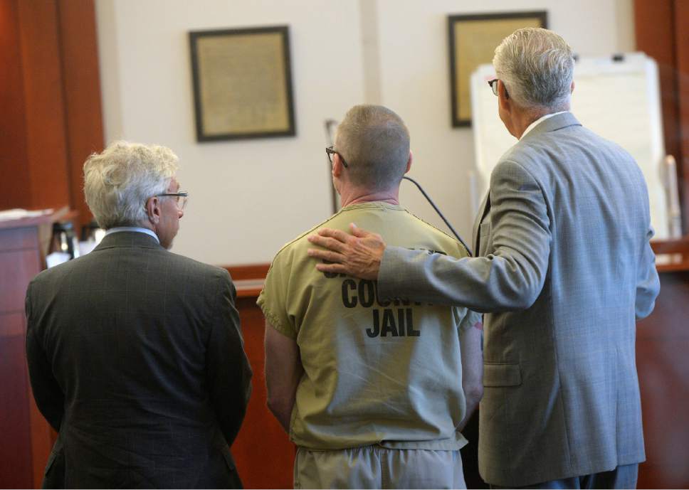 Al Hartmann  |  The Salt Lake Tribune
Craig Crawford, accused of killing his husband, 72-year-old John Williams, last year by setting their Capitol Hill home pleads guilty in Judge Vernice Trease's 3rd District Court in Salt Lake City Tuesday June 27.  His defense lawyers Mark Moffat, left, and Jim Bradshaw, right.