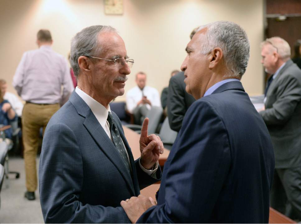Al Hartmann  |   Tribune file photo

Salt Lake County County Recorder Gary Ott, left, speaks with District Attorney Sim Gill at the conclusion of a Salt Lake County Council meeting on findings of the County Auditor's performance audit of his office Tuesday Oct. 4, 2016.