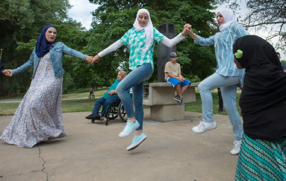 Rick Egan  |  The Salt Lake Tribune


Participants dance at the Eid Mubarak to celebrate the end of Ramadan. The event was hosted by Women of the World at Sugar House Park on Monday, June 26, 2017.