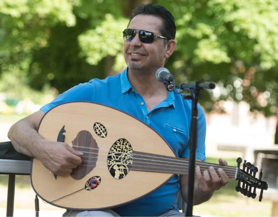 Rick Egan  |  The Salt Lake Tribune


Annan Jasim plays the Oud at the Eid Mubarak to celebrate the end of Ramadan. The event was hosted by Women of the World at Sugar House Park on Monday, June 26, 2017.
