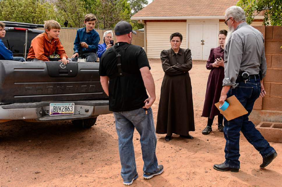 Trent Nelson  |  The Salt Lake Tribune
An FLDS woman confronts UEP agent Ted Barlow and Mohave County Constable Mike Hoggard as they evict her from her home in Colorado City, AZ, Tuesday May 9, 2017.