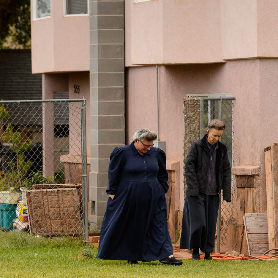 Trent Nelson  |  The Salt Lake Tribune
FLDS members Shannon Darger and Liz (last name unknown) walk away from their Colorado City, AZ, home after being evicted by the UEP Trust Wednesday May 10, 2017. Like other FLDS members, the two women consider working with the UEP Trust to be against their religious beliefs and would not sign an occupancy agreement with the trust.