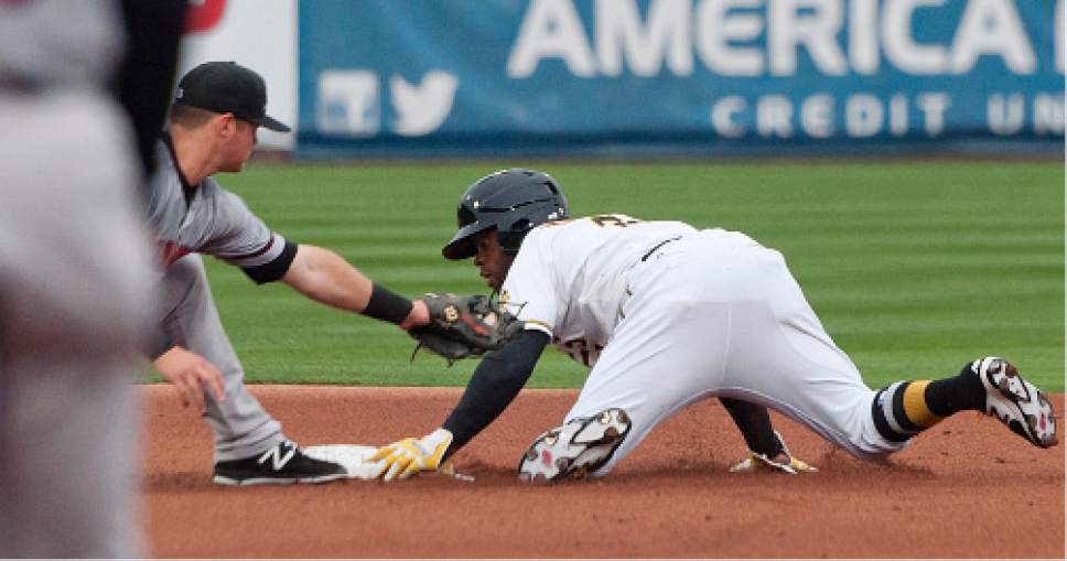 Michael Mangum  |  Special to the Tribune

Salt Lake Bees center fielder Eric Young, Jr. avoids the tag as he steals second base in front of Sacramento River Cats second baseman Kelby Tomlinson (21) during their game at Smith's Ballpark on Tuesday, April 11, 2017.