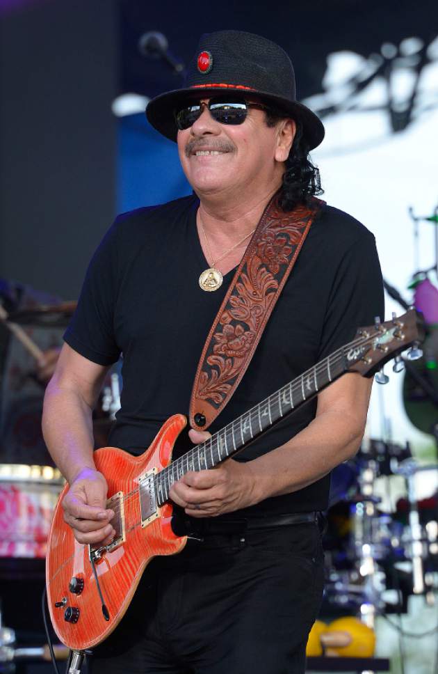 Leah Hogsten  |  The Salt Lake Tribune

Legendary musician Carlos Santana performs  a sold-out show at Red Butte Garden, July 29, 2014.